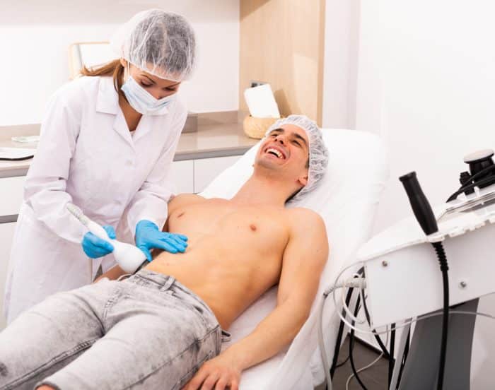 A man comfortable enjoying laser fat removal service by Emerald Laser