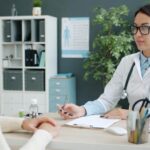 Medical provider consulting with patient about non-surgical body contouring treatment