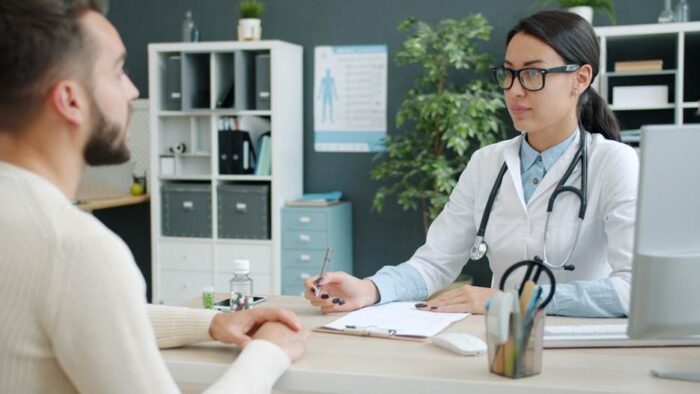 Medical provider consulting with patient about non-surgical body contouring treatment