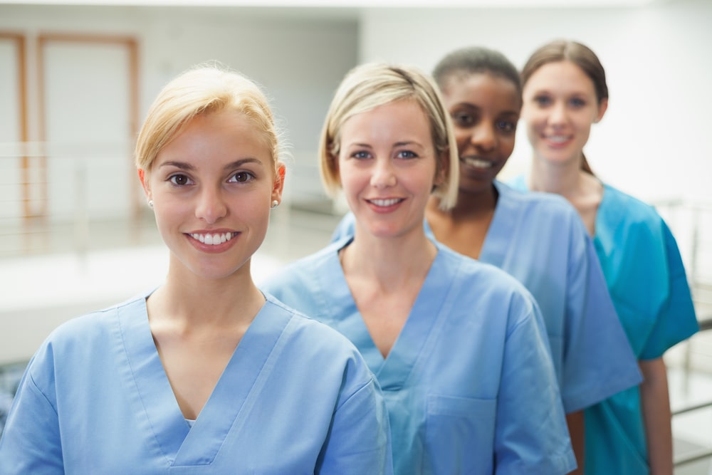 healthcare professionals wearing blue scrubs